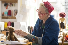 KIAZ TREPTE delicately repairs a toy dog in the Leith Toy Hospital, Edinburgh.

Kiaz has practiced for thirty-five years in the fashion industry. Kiaz was a private fitter for Vivienne Westwood at her Bond Street shop, producing one-off couture garments from archive patterns, right through to wedding gowns for VIP clients.